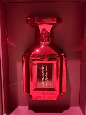 Aroma360 Red luxury Parfum in red bottle.
